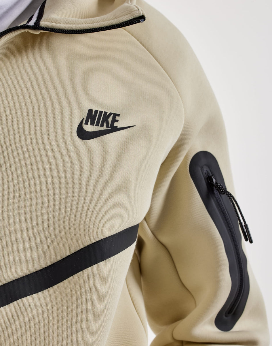 beige nike hoodie with black tick