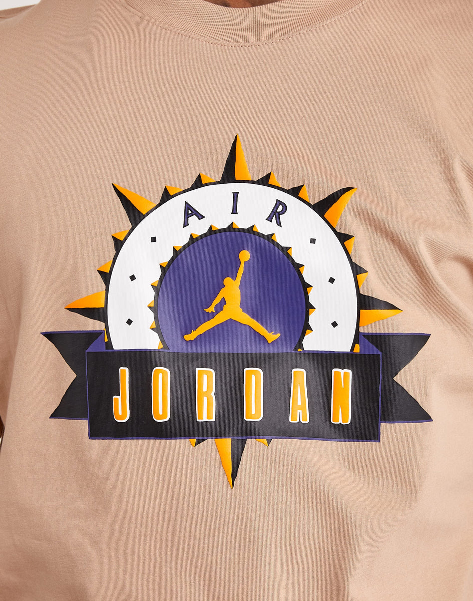 white and gold jordan shirt