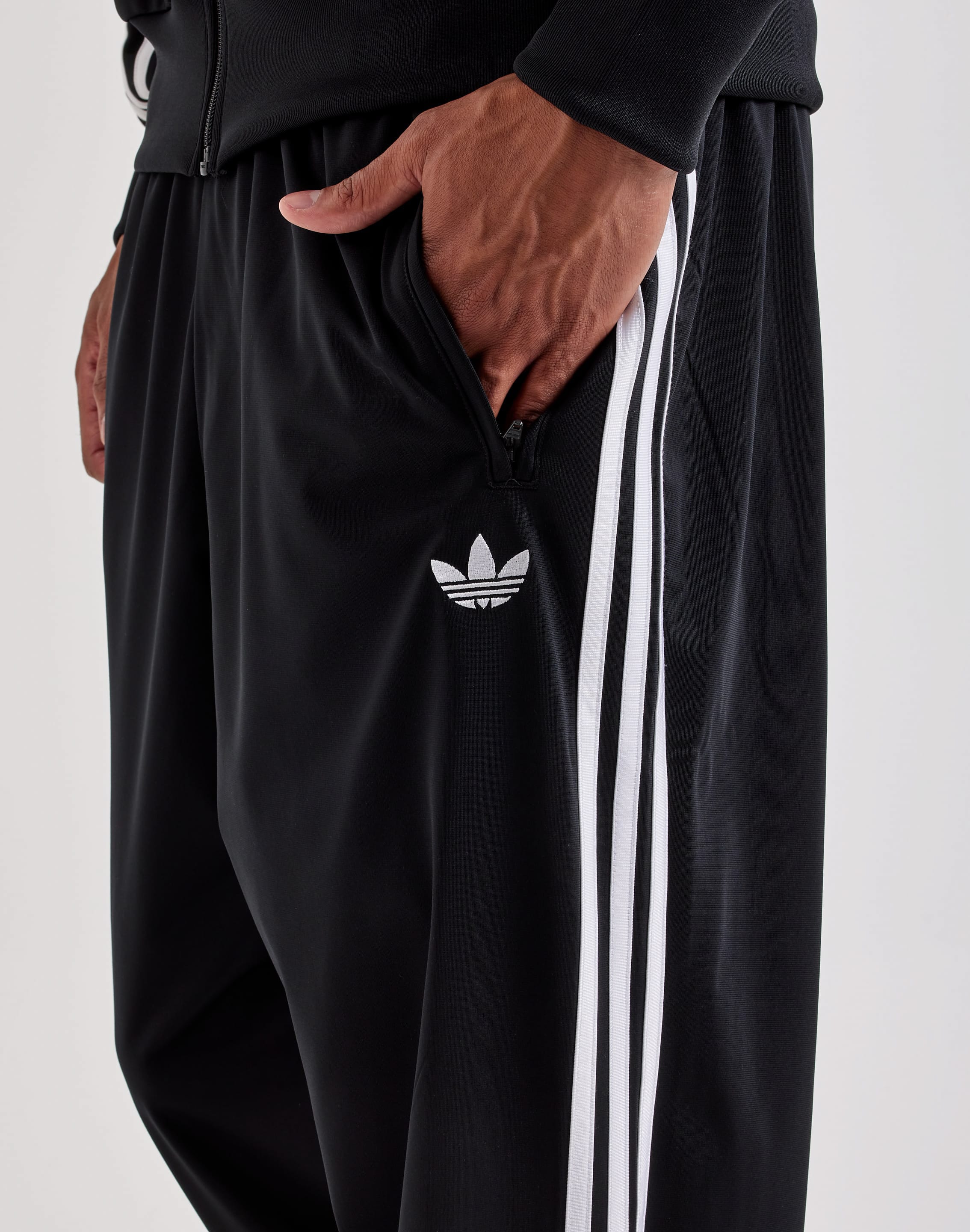 Photo of Adidas Firebird Track Pants