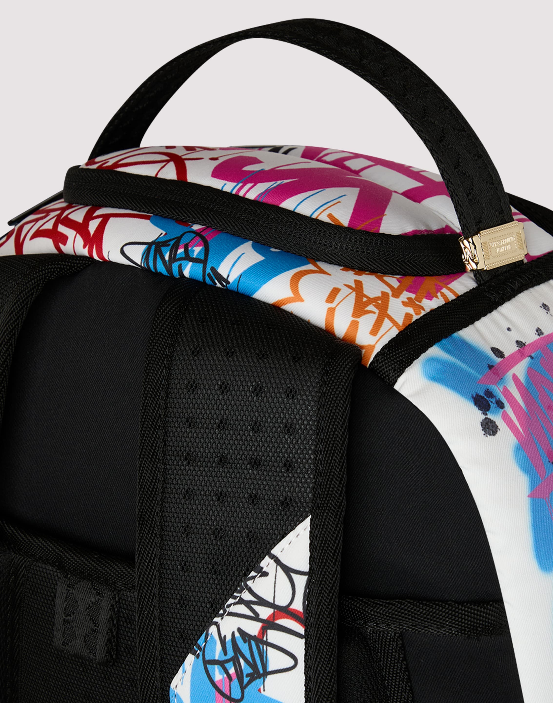 Photo of Sprayground Tagged Puffer Backpack