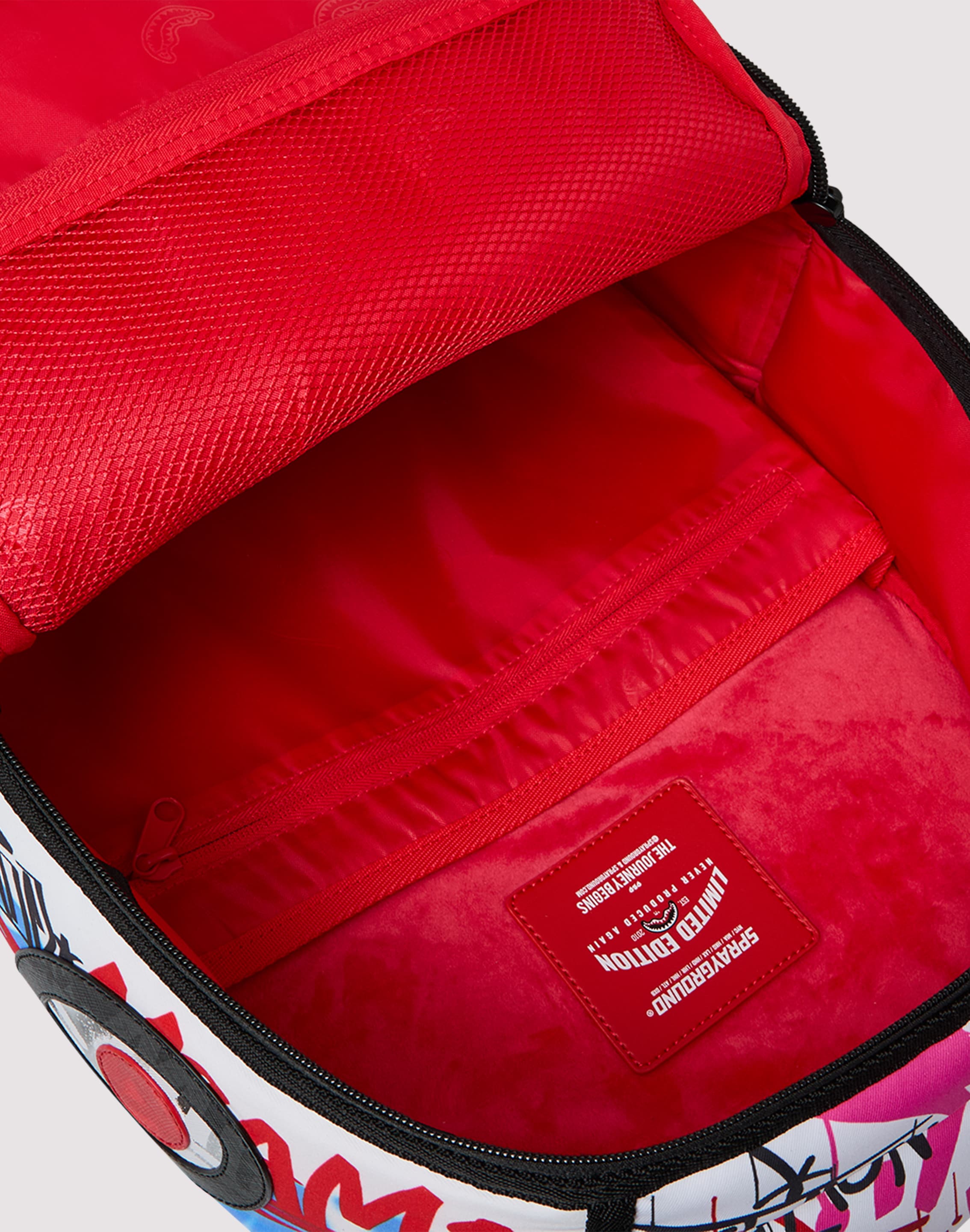 Photo of Sprayground Tagged Puffer Backpack