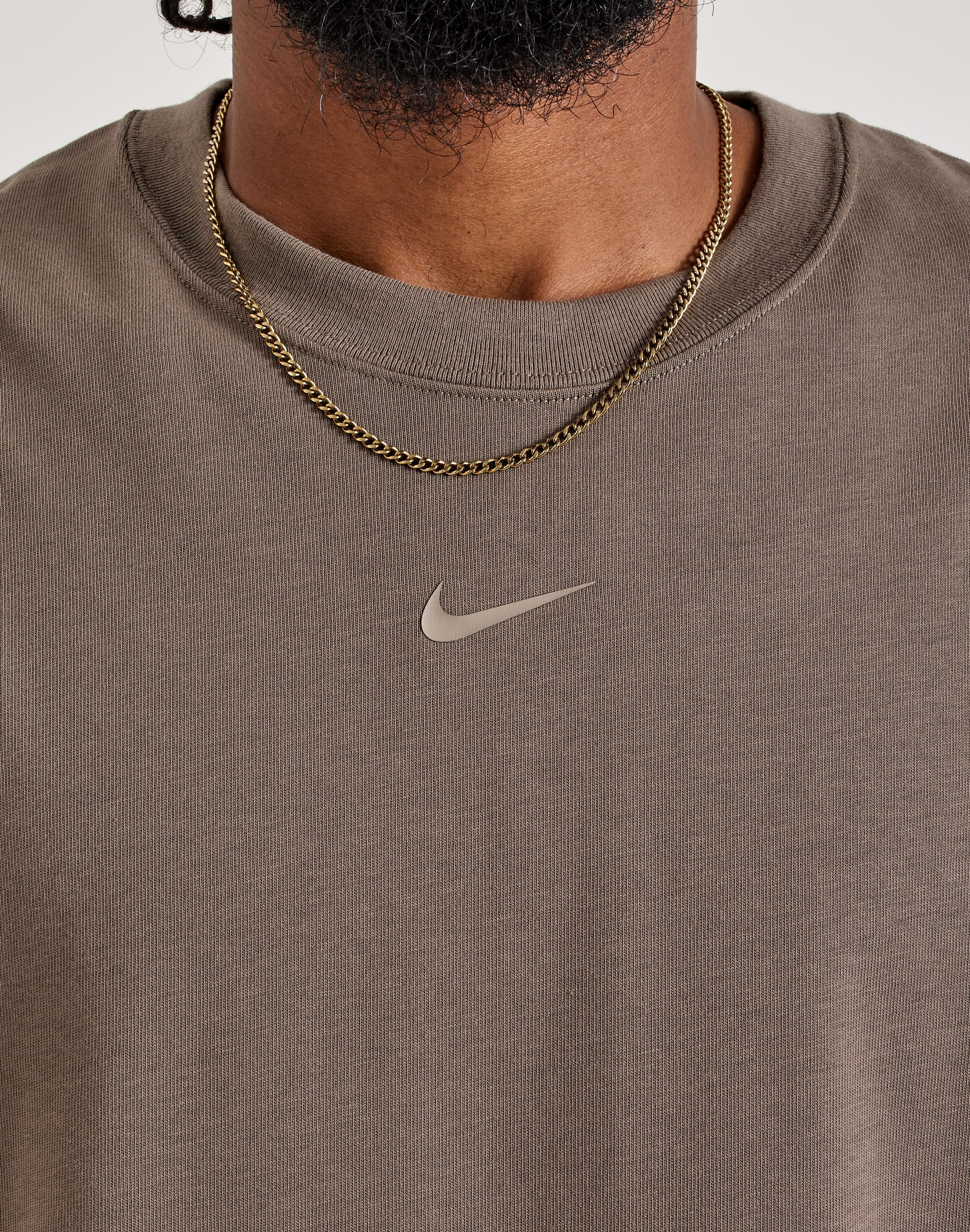 nike tee with swoosh in the middle