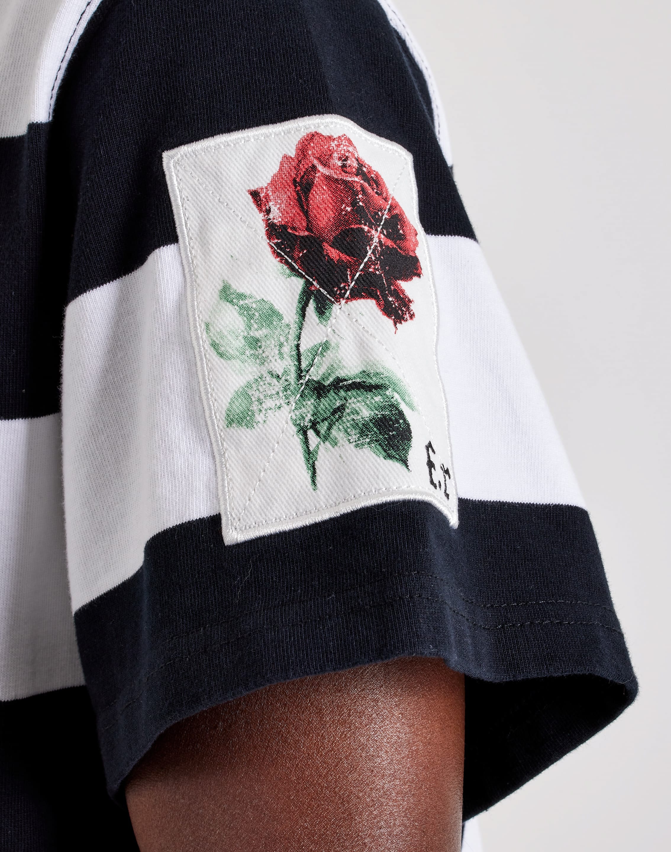Photo of First Row Patch Polo Shirt