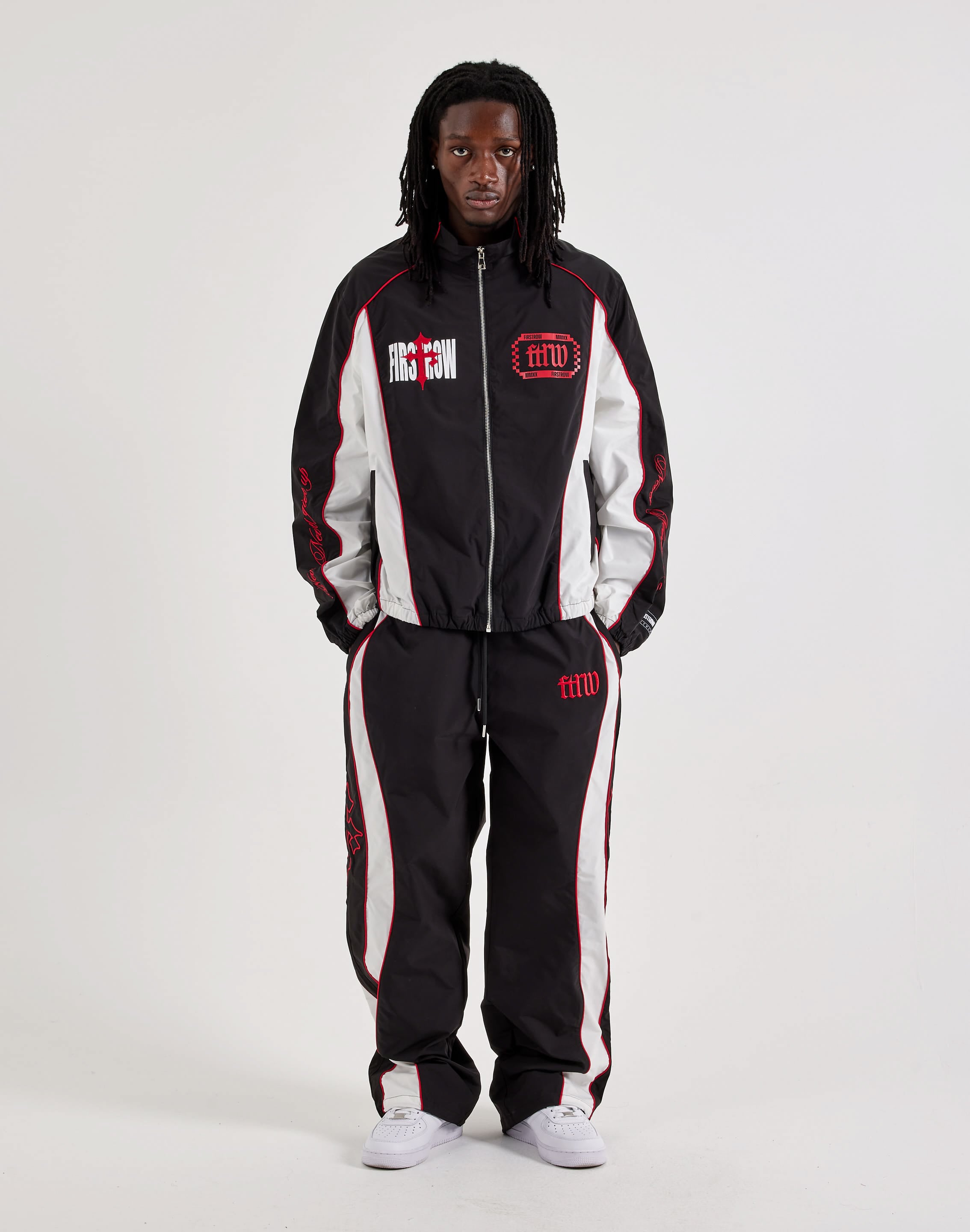 Photo of First Row Track Pants