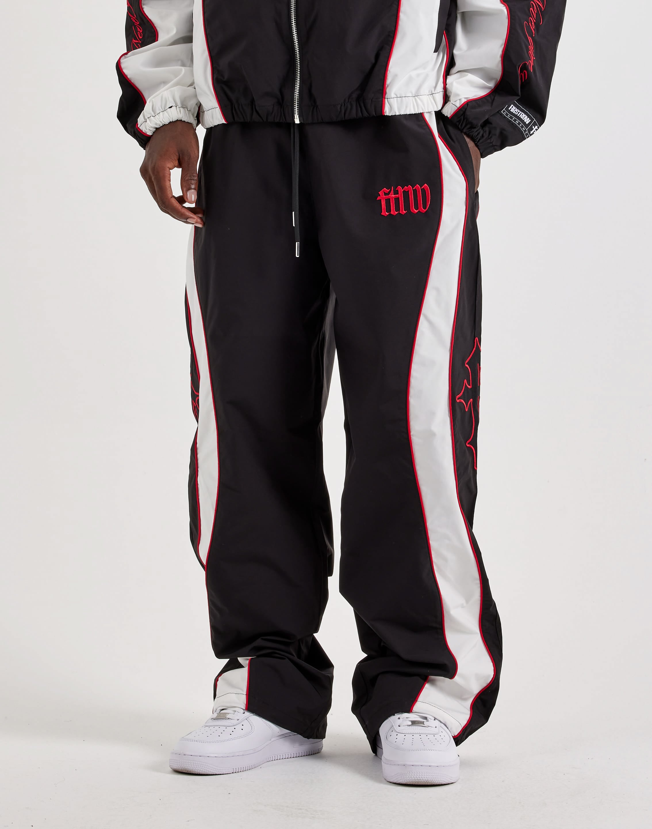 Photo of First Row Track Pants
