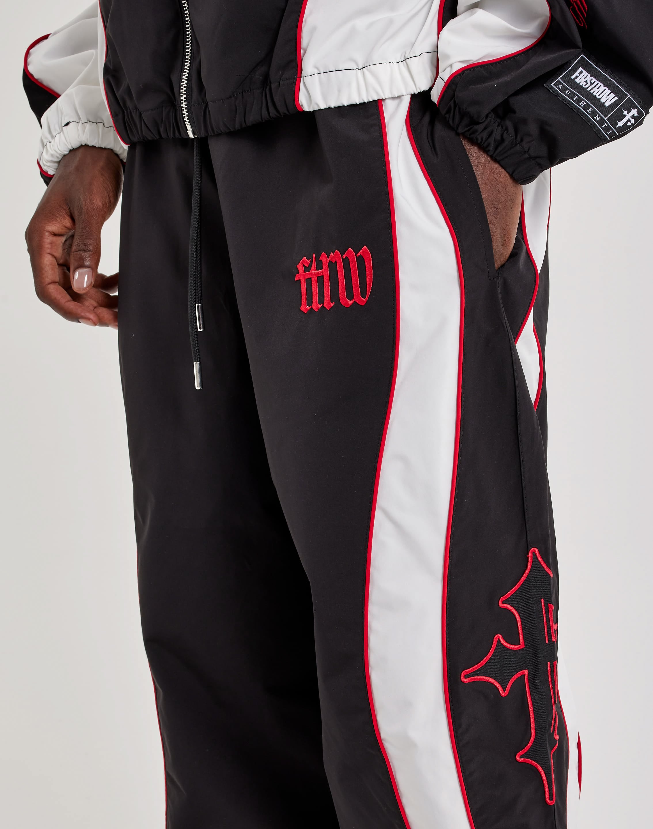 Photo of First Row Track Pants