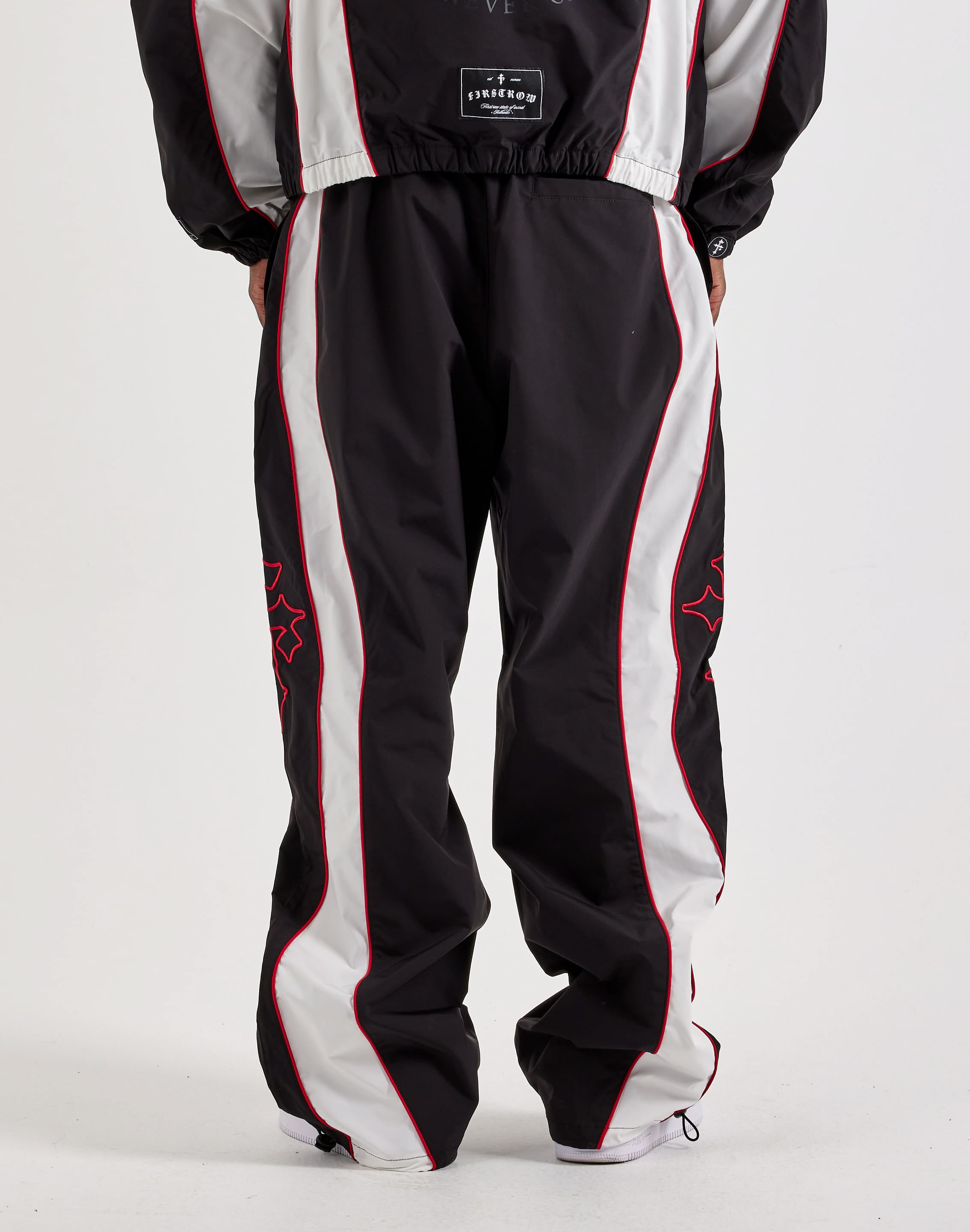 Photo of First Row Track Pants