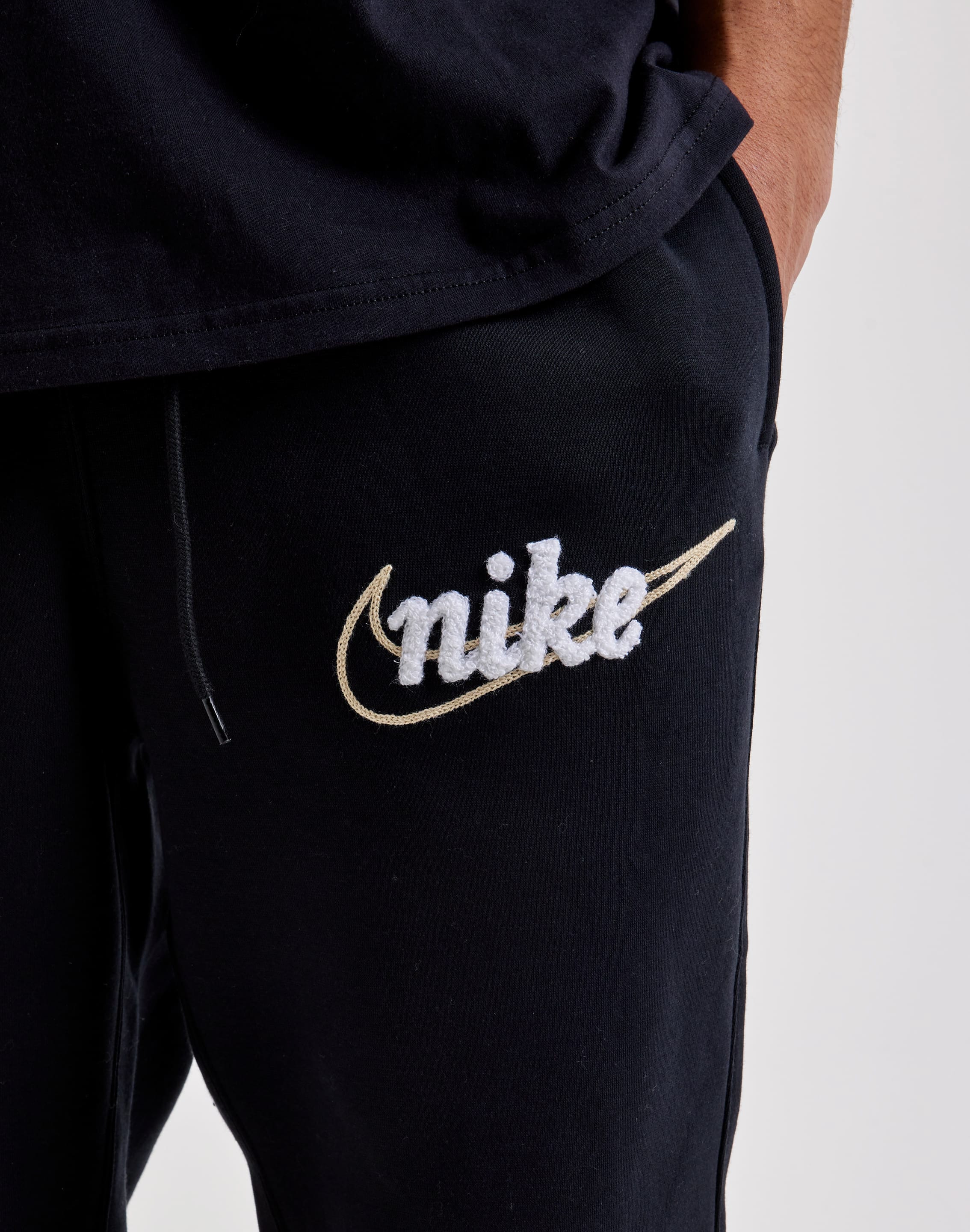 black gold nike joggers
