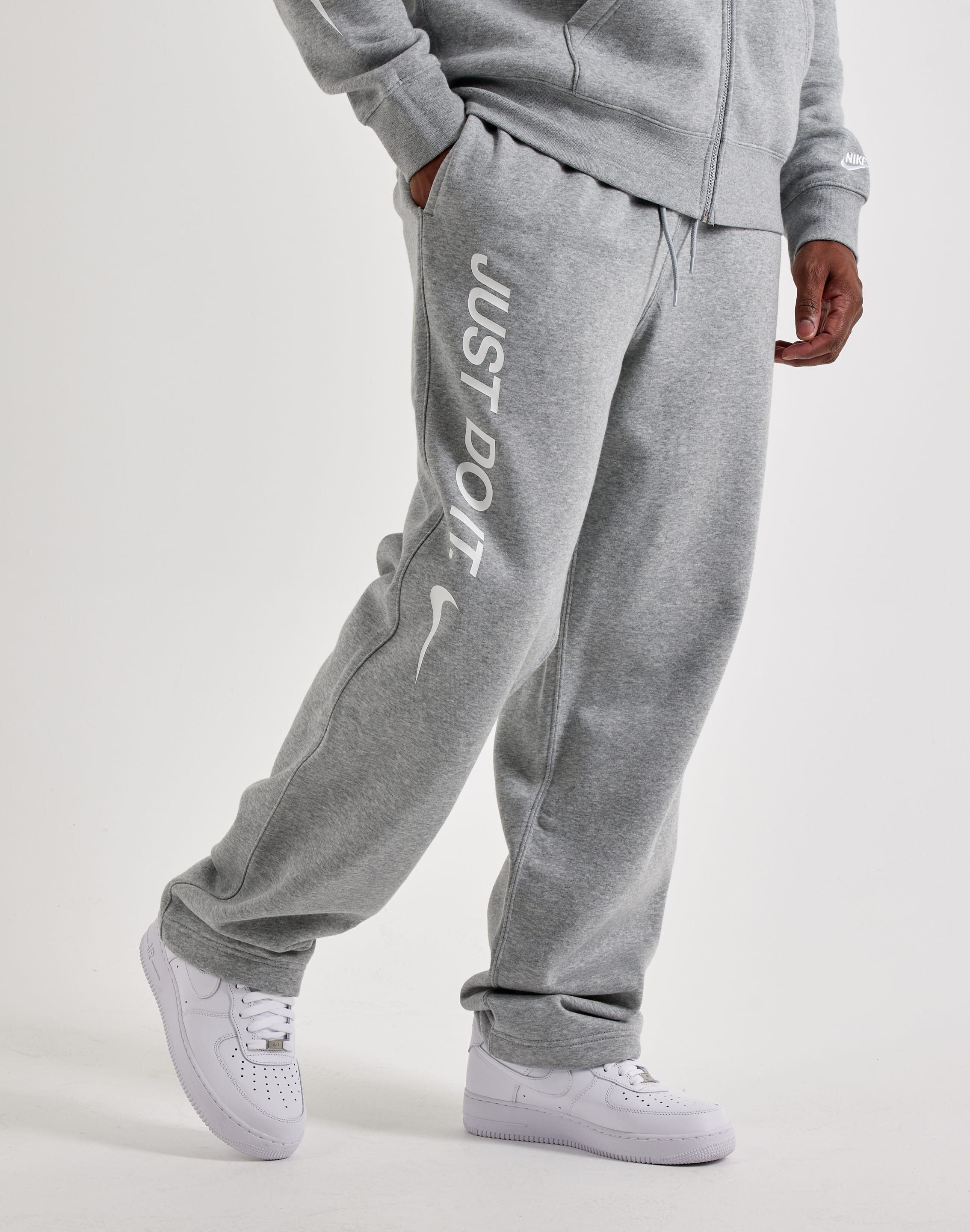 nike open hem club pants