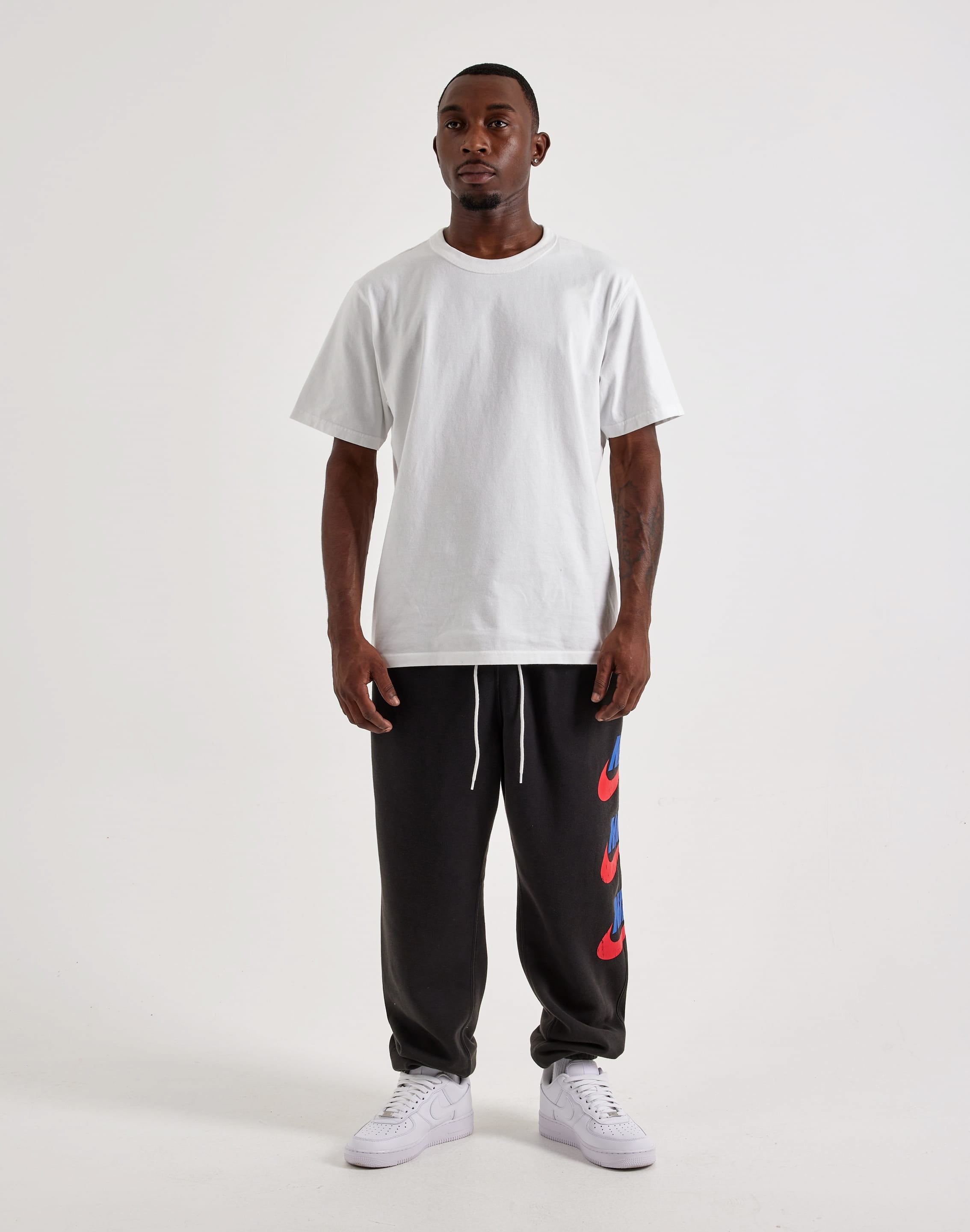 Photo of Nike Club Fleece Graphic Cuff Pants