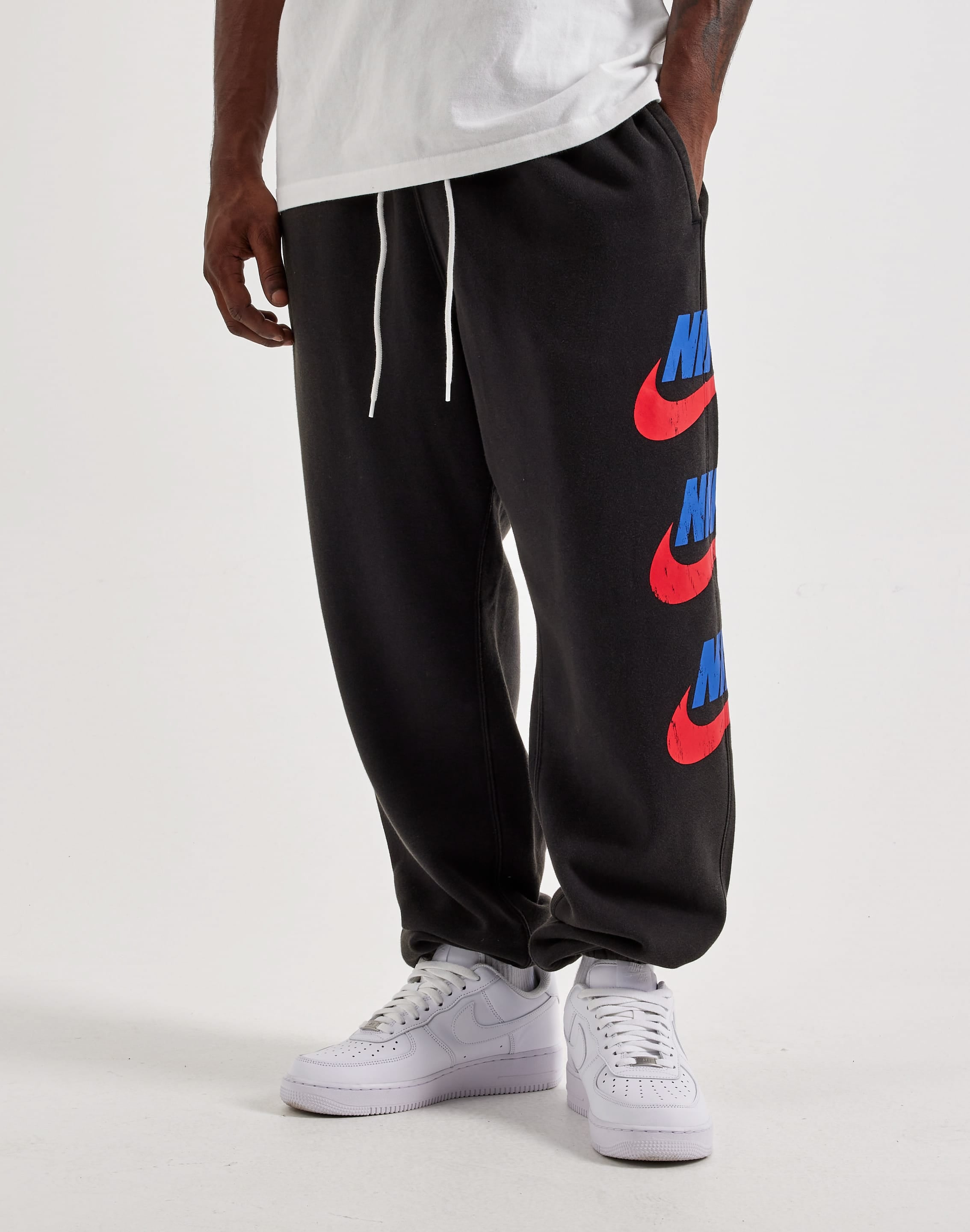 Photo of Nike Club Fleece Graphic Cuff Pants