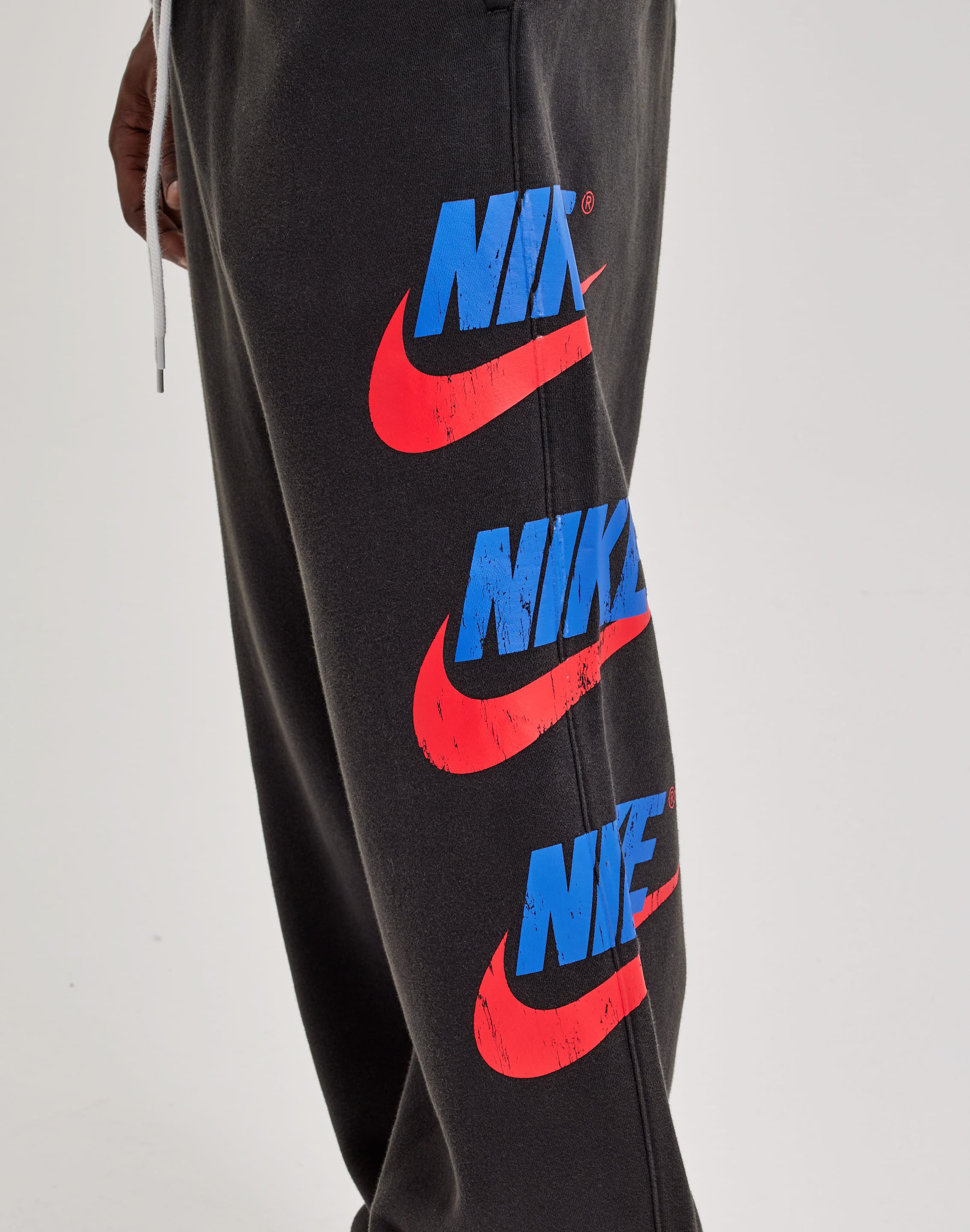 Photo of Nike Club Fleece Graphic Cuff Pants